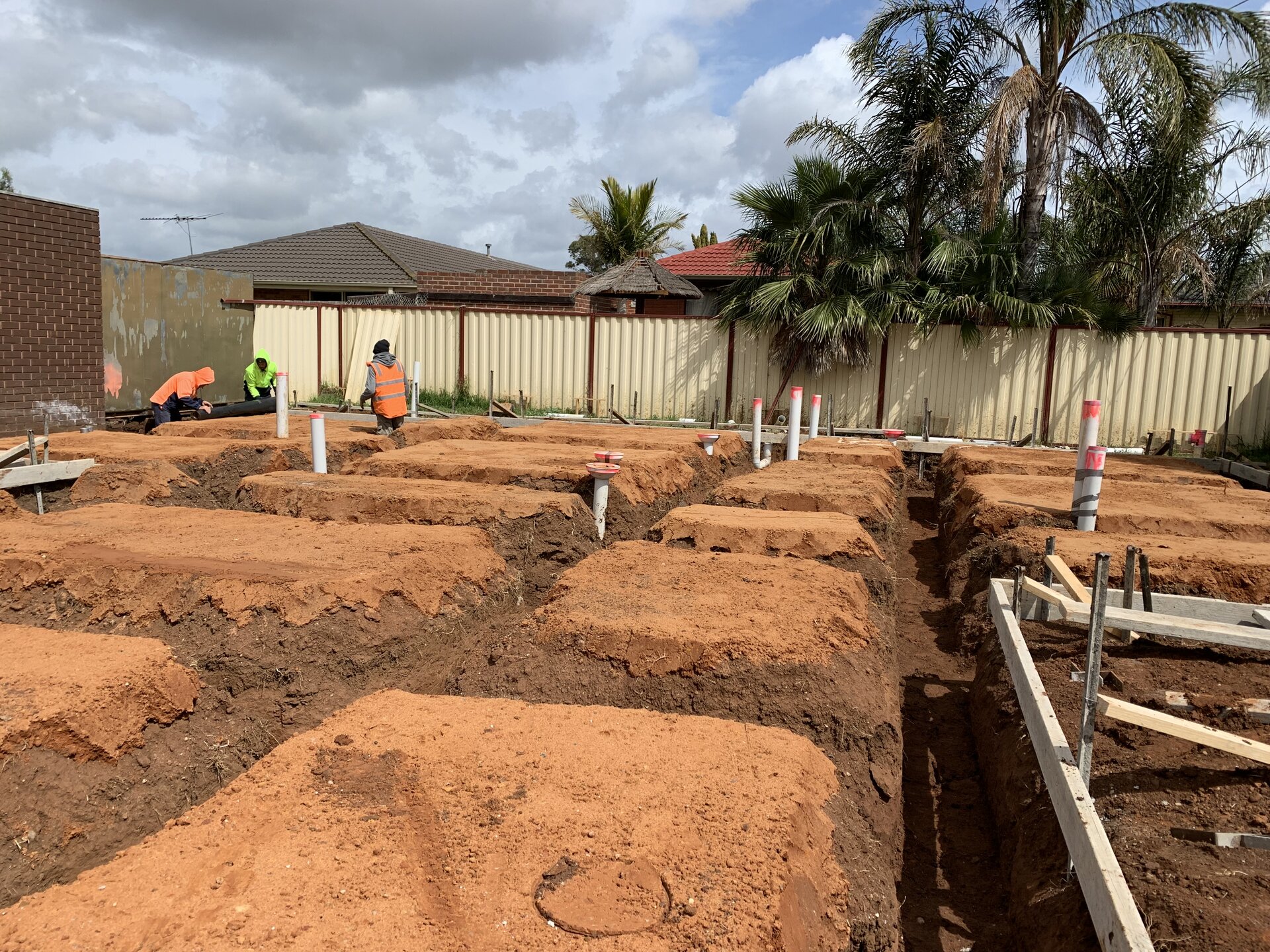 Team on site preparing foundation trenches